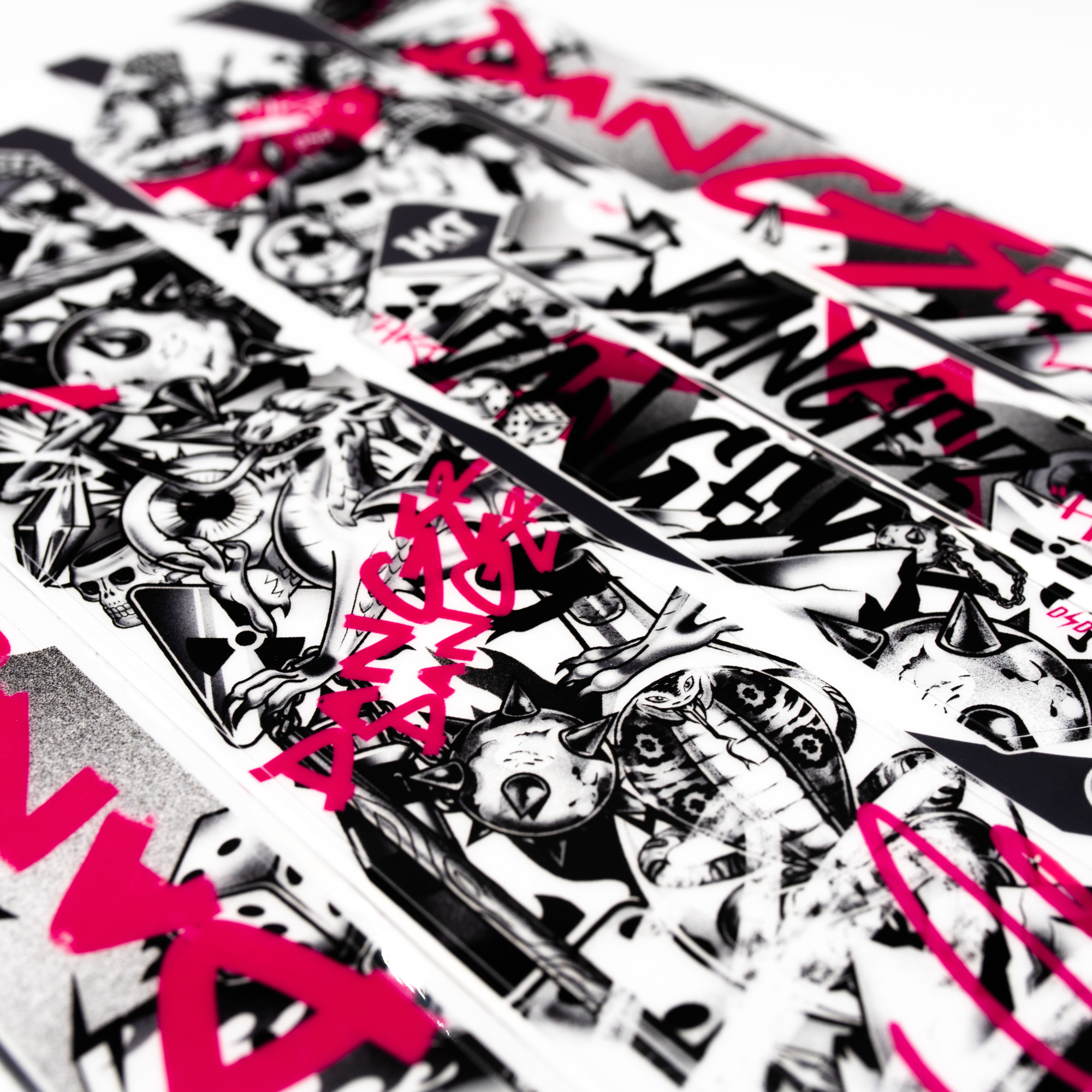 Stack of stickers with black and white designs and pink text on a white background
