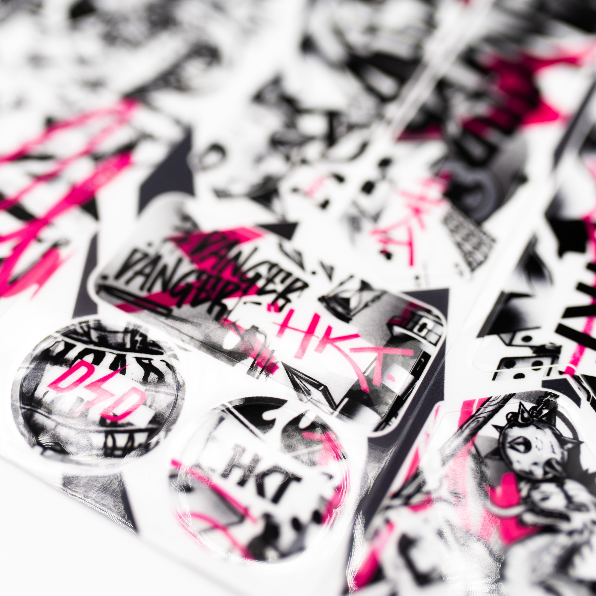 Stickers with black and pink designs on a white background