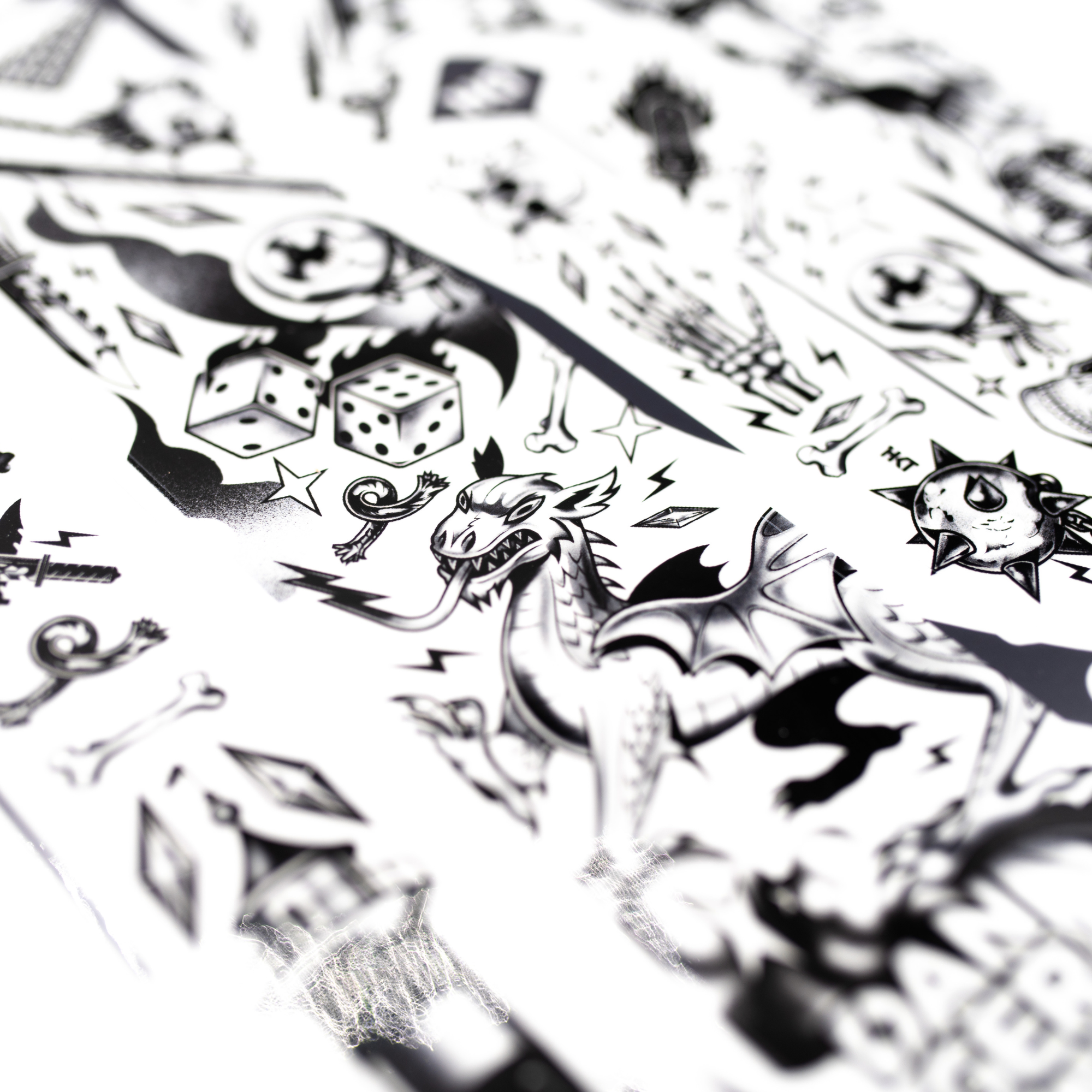 Various black and white designs showing the dragon and dice design on the frame kit.