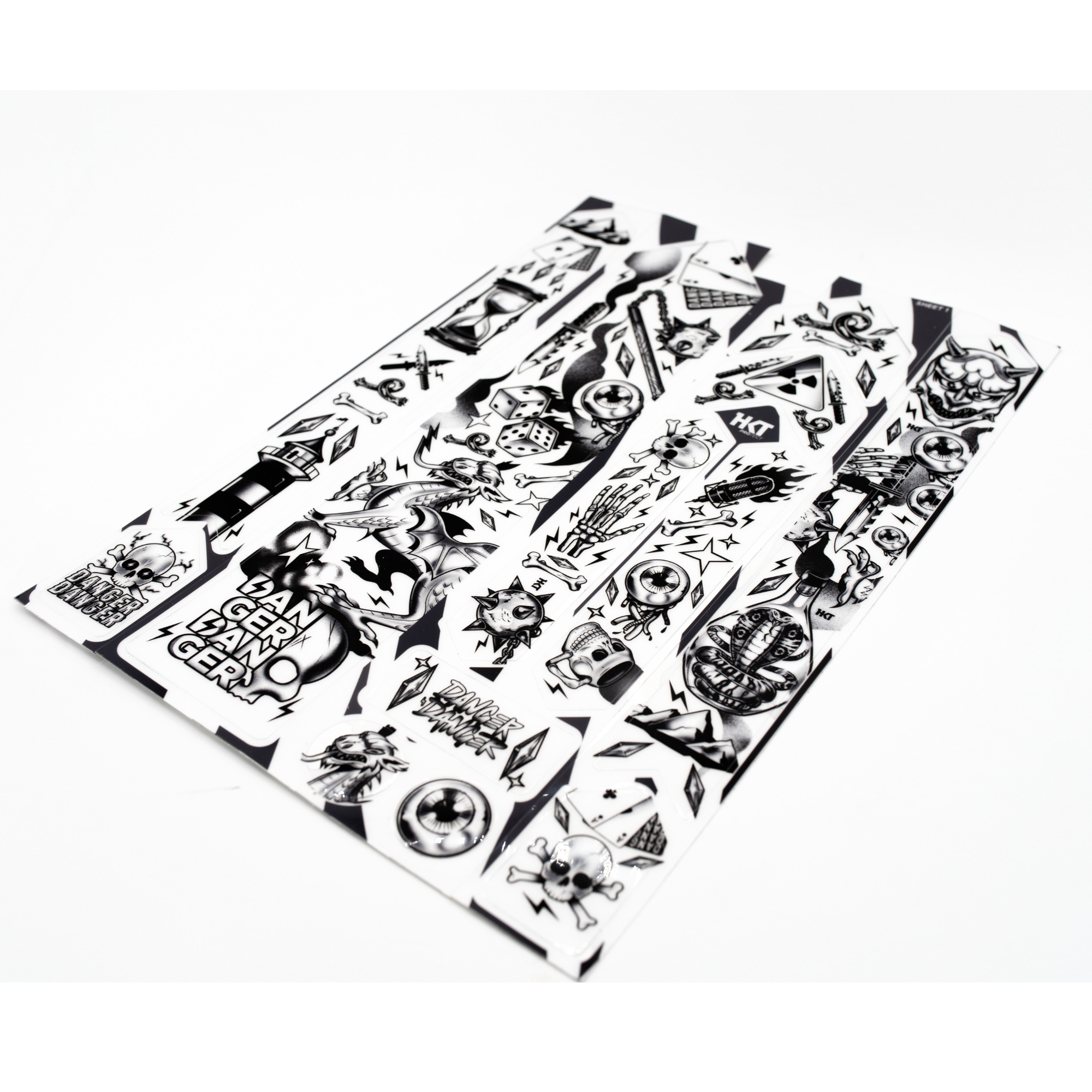 Sheet of black and white Dead Luck frame protection kit on a white background