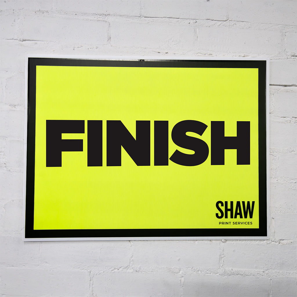 Finish event sign in flurescent yellow and black text that says finish on it.
