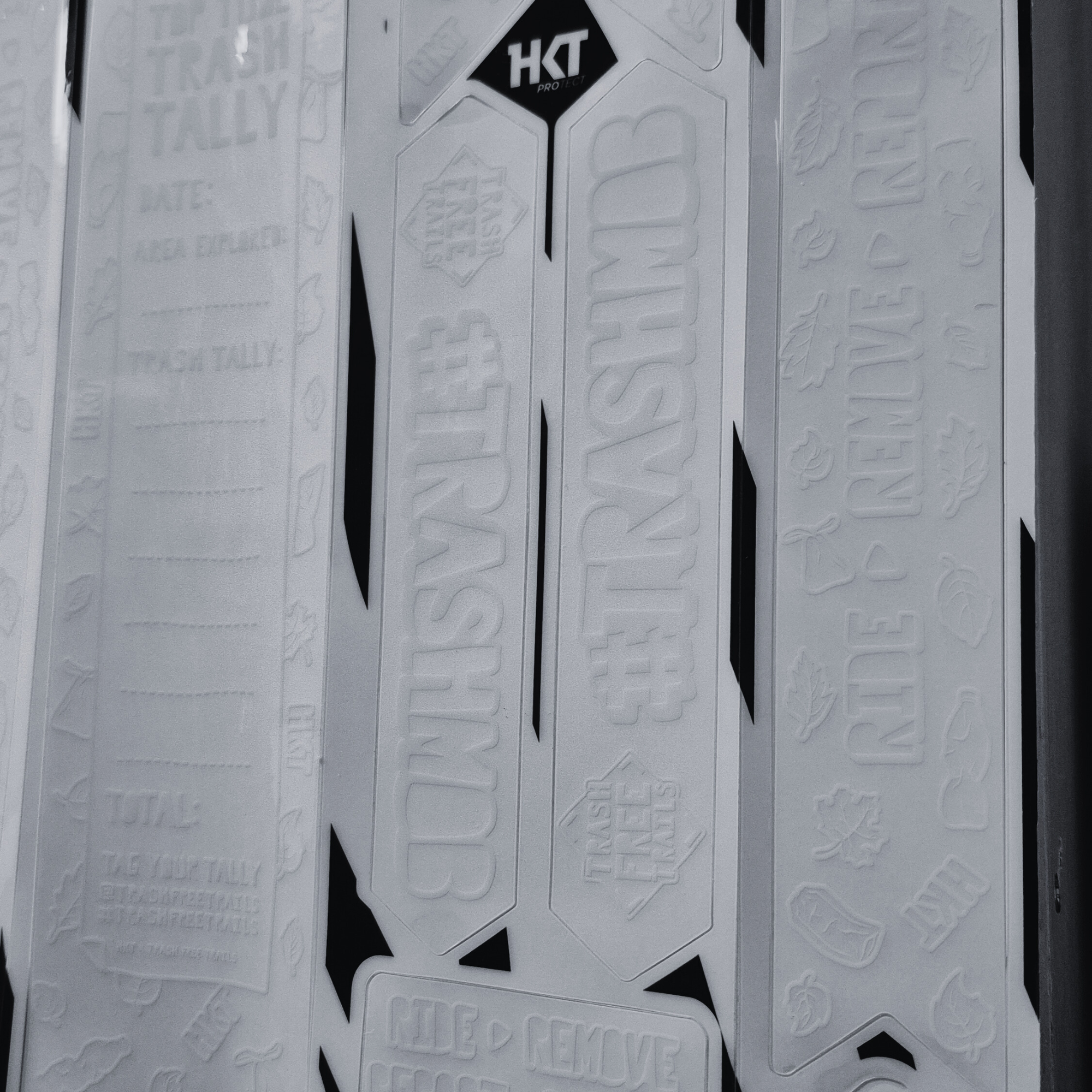 Close-up of white frame protection kit for Trash Free Trails.