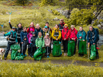 Trash Free Trails team adults and children with their trash free bin bags and litter pickers.
