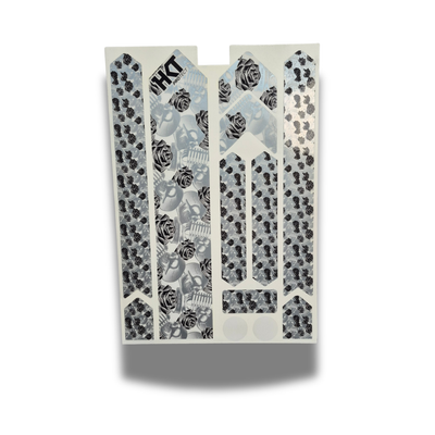 Rock and roll bike frame protection kit with floral and skulls on a white background