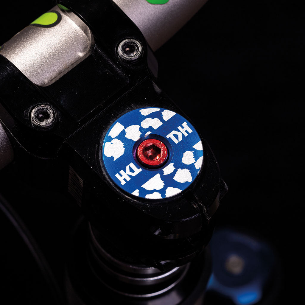Wild Style Blue Stripe Stem Cap with Red Bolt.
