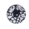 Wild Style Text black stem cap with black bolt on a white background.